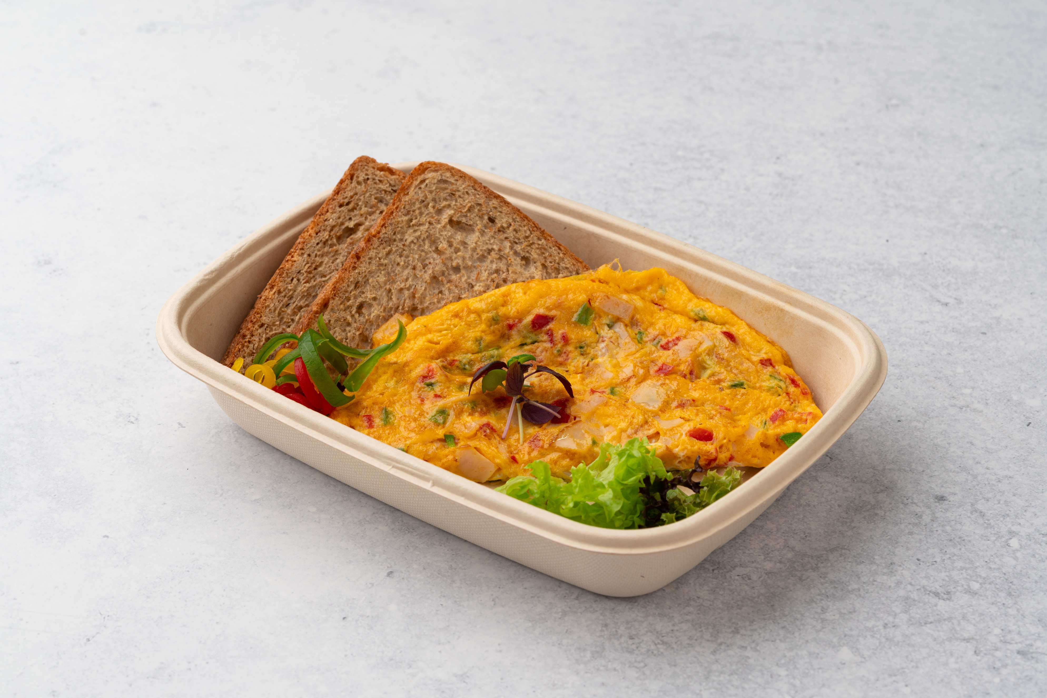 Western Omelette Stuffed With Cheese Turkey Mixed Capsicum Vegetables Served With Brown Bread
